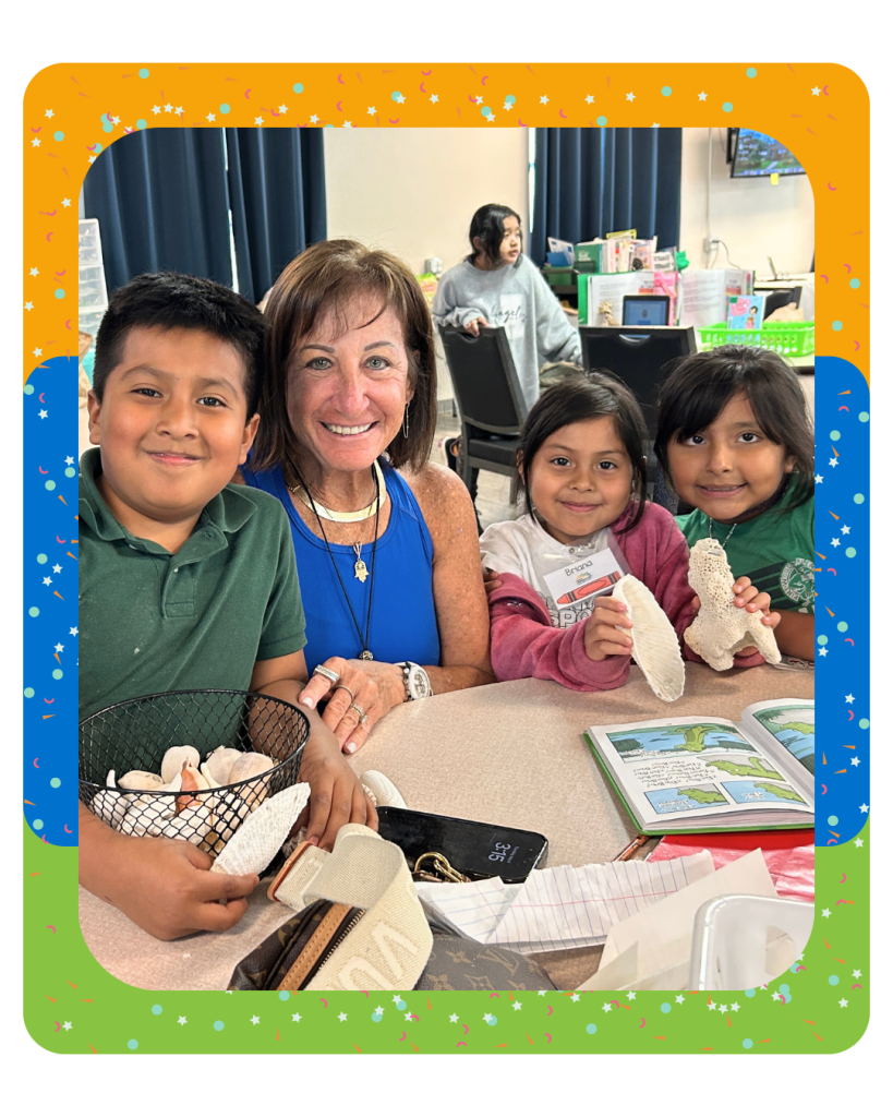 Three New Horizons of SWFL elementary school students and a volunteer sit at a table holding shells.